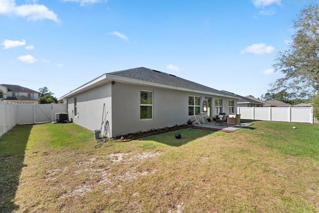 311 Athabasca Pl, Kissimmee, FL 34759 - back of property featuring a patio, a fenced backyard, stucco siding, cooling unit, and a yard