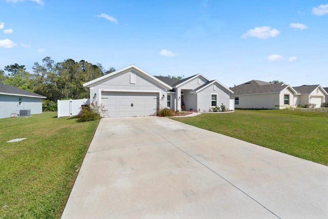 311 Athabasca Pl, Kissimmee, FL 34759 - ranch-style home with driveway, an attached garage, central air condition unit, and a front yard