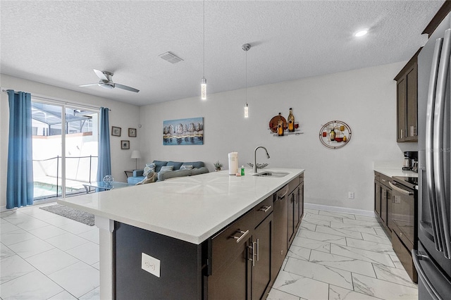 1566 Plunker Dr, Davenport, FL 33896 - kitchen with range with electric cooktop, a sink, visible vents, ceiling fan, and marble finish floor