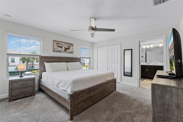 1566 Plunker Dr, Davenport, FL 33896 - bedroom with ceiling fan, visible vents, a closet, baseboards, and light carpet
