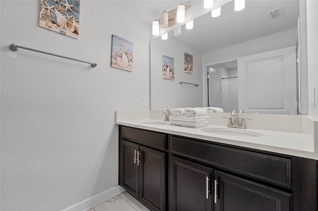 1566 Plunker Dr, Davenport, FL 33896 - full bathroom featuring marble finish floor, a sink, double vanity, and baseboards