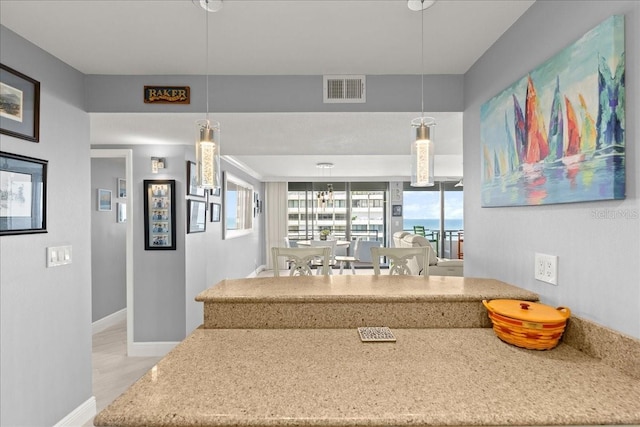2828 N Atlantic Ave Unit 1903, Daytona Beach, FL 32118 - interior space with pendant lighting, baseboards, and visible vents