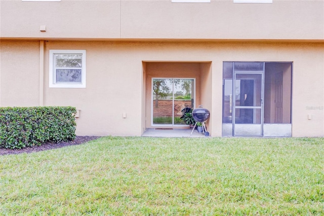 2934 Rodrick Cir, Orlando, FL 32824 - rear view of property with a lawn, stucco siding, and a patio area