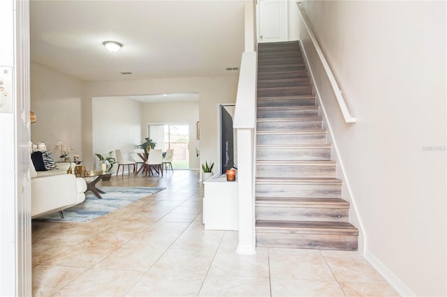 2934 Rodrick Cir, Orlando, FL 32824 - stairway with tile patterned floors and visible vents