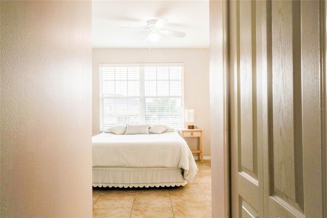 2934 Rodrick Cir, Orlando, FL 32824 - bedroom with a ceiling fan and light tile patterned flooring