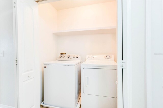 2934 Rodrick Cir, Orlando, FL 32824 - washroom with washing machine and dryer and laundry area