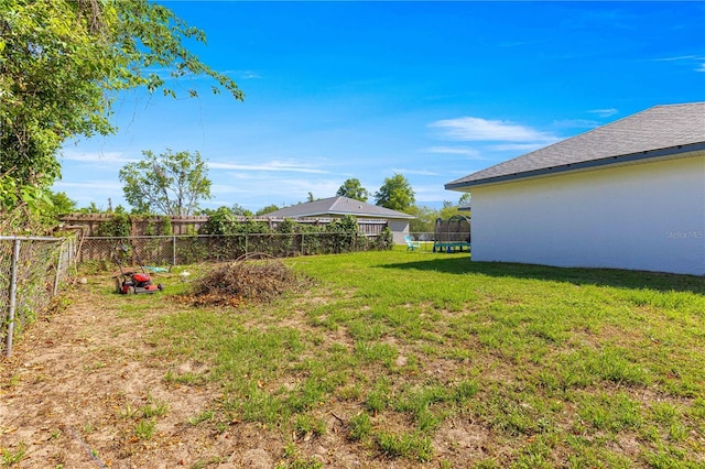 1401 NW 63rd Pl, Ocala, FL 34475 - view of yard with a trampoline