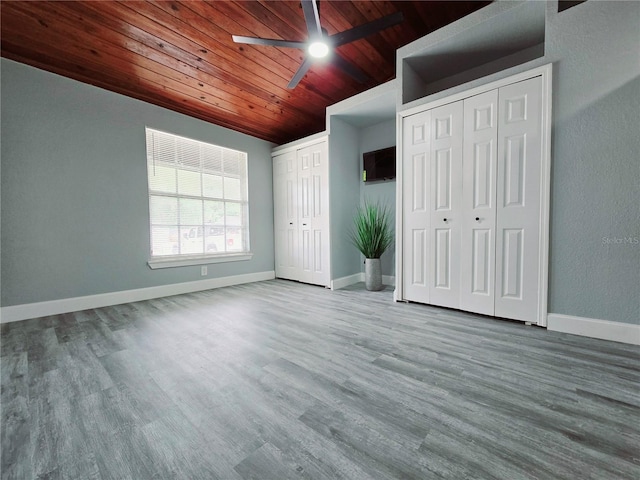 218 W Magnolia Ave, Longwood, FL 32750 - unfurnished bedroom featuring wood ceiling, wood finished floors, and multiple closets