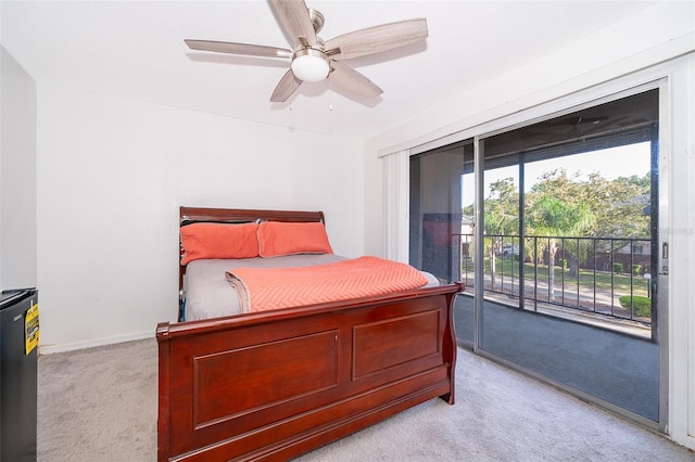 bedroom with access to outside, light colored carpet, and ceiling fan