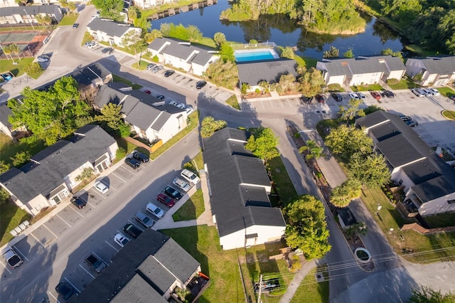 bird's eye view with a residential view and a water view