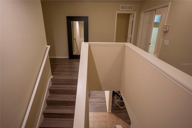 staircase featuring baseboards
