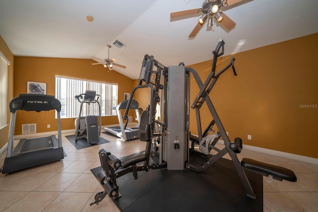 workout area with a ceiling fan, baseboards, and vaulted ceiling