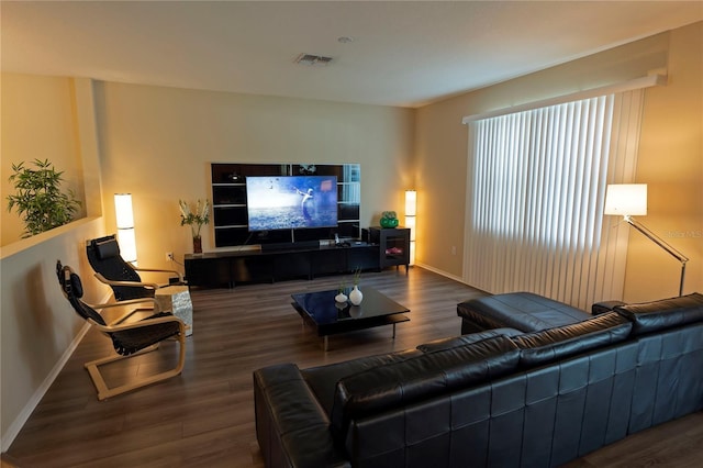 living room with wood finished floors and baseboards