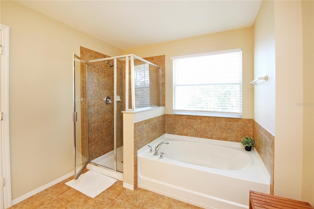 bathroom featuring a shower stall and a garden tub
