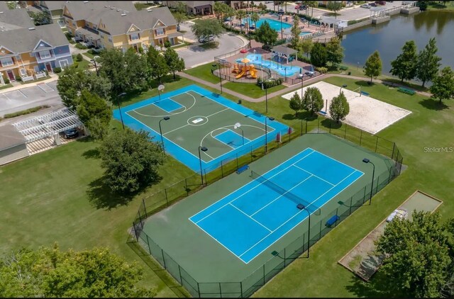 2610 Lodi Cir Unit 104, Kissimmee, FL 34746 - drone / aerial view of a pool area and a nearby body of water