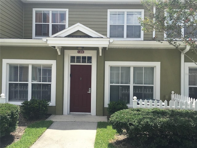 2610 Lodi Cir Unit 104, Kissimmee, FL 34746 - property entrance with stucco siding