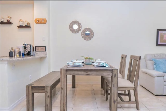 2610 Lodi Cir Unit 104, Kissimmee, FL 34746 - dining area with light tile patterned flooring and baseboards