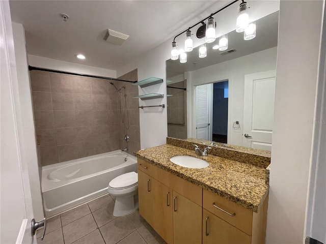 bathroom with tile patterned flooring, vanity, toilet, visible vents, and shower / tub combination