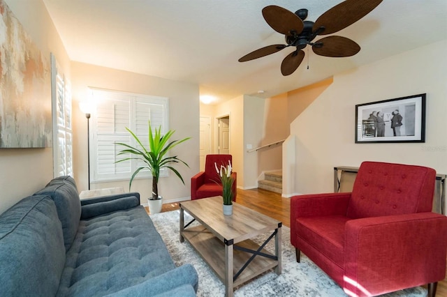 5101 Staniard Dr, Kissimmee, FL 34746 - living room featuring stairway, baseboards, a ceiling fan, and wood finished floors