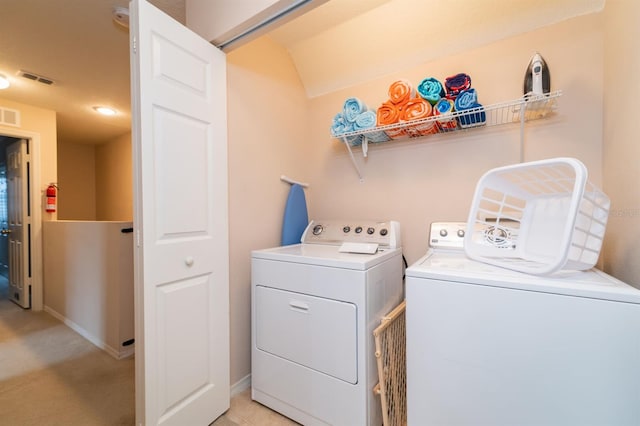 5101 Staniard Dr, Kissimmee, FL 34746 - laundry area with visible vents, washer and clothes dryer, and laundry area