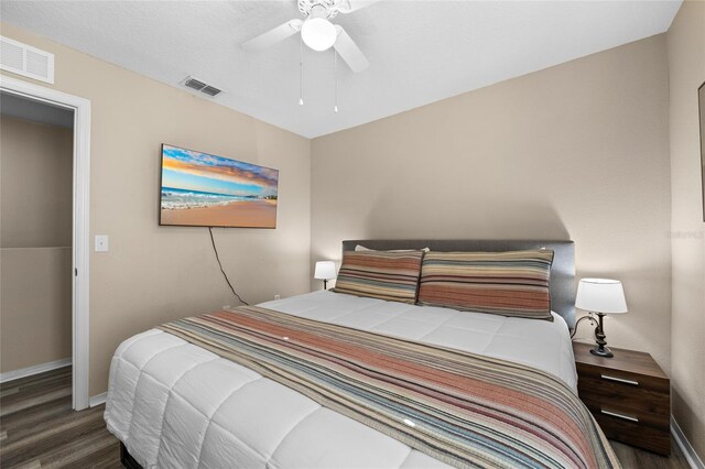 5101 Staniard Dr, Kissimmee, FL 34746 - bedroom featuring visible vents, ceiling fan, wood finished floors, and baseboards