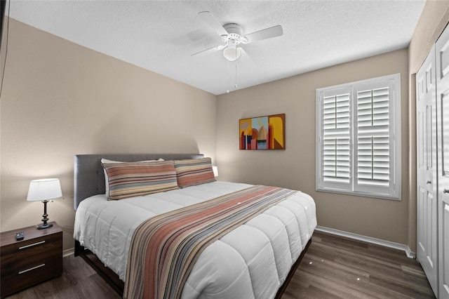5101 Staniard Dr, Kissimmee, FL 34746 - bedroom with a closet, baseboards, ceiling fan, a textured ceiling, and wood finished floors
