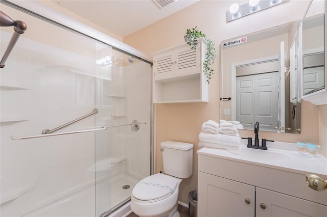 5101 Staniard Dr, Kissimmee, FL 34746 - full bath featuring a shower stall, vanity, a textured ceiling, and toilet