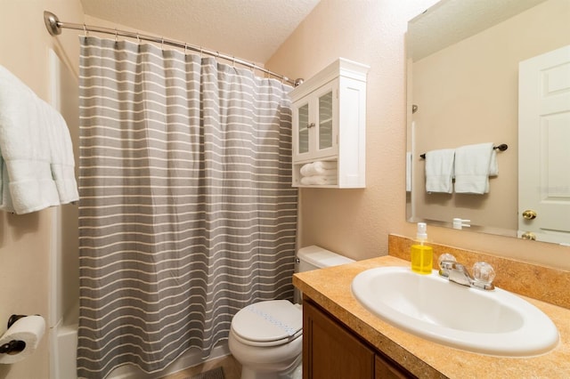 5101 Staniard Dr, Kissimmee, FL 34746 - bathroom featuring toilet, shower / bathtub combination with curtain, vanity, and a textured ceiling