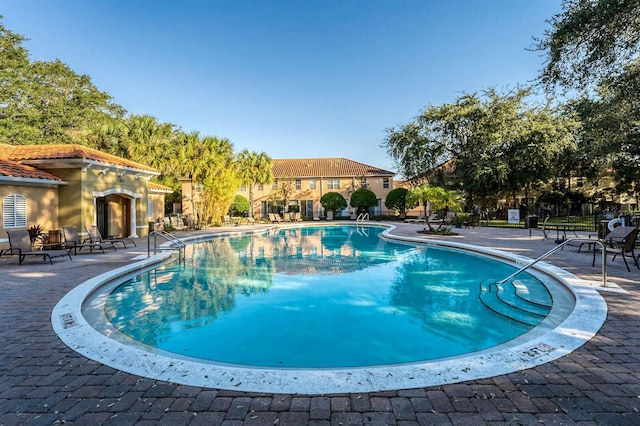 5101 Staniard Dr, Kissimmee, FL 34746 - community pool featuring a patio