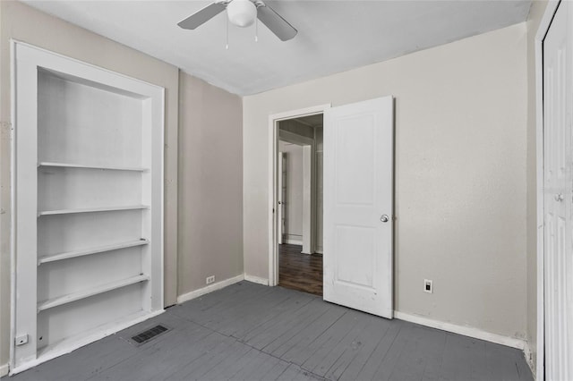 514 Massachusetts Ave, Saint Cloud, FL 34769 - unfurnished bedroom featuring baseboards, dark wood-style floors, visible vents, and a ceiling fan