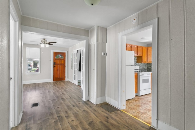 514 Massachusetts Ave, Saint Cloud, FL 34769 - hall featuring wood finished floors, baseboards, and visible vents