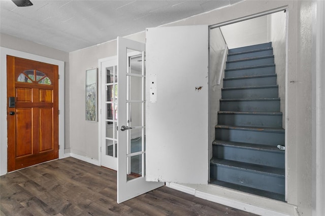 514 Massachusetts Ave, Saint Cloud, FL 34769 - foyer with dark wood-style floors, french doors, and stairway