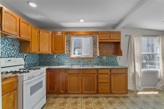 514 Massachusetts Ave, Saint Cloud, FL 34769 - kitchen with decorative backsplash, a sink, beam ceiling, white gas range oven, and brown cabinets