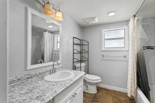 514 Massachusetts Ave, Saint Cloud, FL 34769 - bathroom with toilet, vanity, a textured ceiling, baseboards, and a textured wall