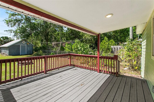 514 Massachusetts Ave, Saint Cloud, FL 34769 - deck featuring an outbuilding, a storage unit, and a yard