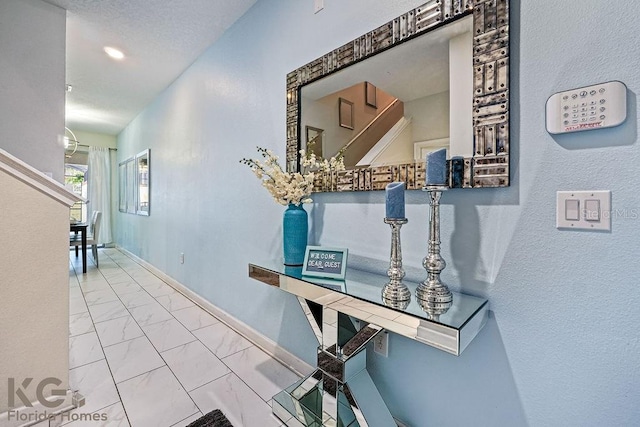 9075 Dogleg Dr, Davenport, FL 33896 - hall featuring marble finish floor and baseboards
