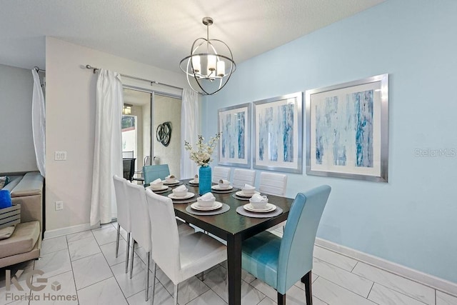 9075 Dogleg Dr, Davenport, FL 33896 - dining space featuring a notable chandelier, baseboards, and a textured ceiling