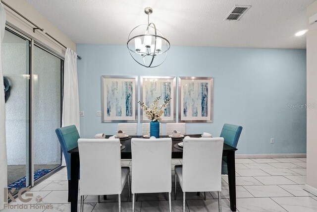 9075 Dogleg Dr, Davenport, FL 33896 - dining area with visible vents, baseboards, marble finish floor, and a chandelier