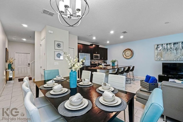 9075 Dogleg Dr, Davenport, FL 33896 - dining room featuring visible vents, recessed lighting, a chandelier, and a textured ceiling