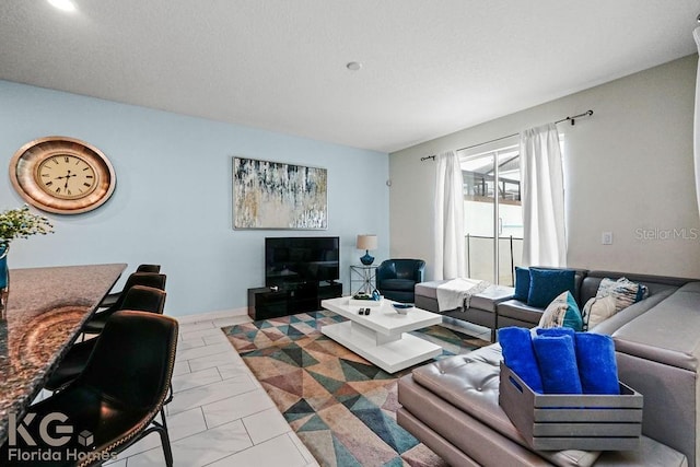 9075 Dogleg Dr, Davenport, FL 33896 - living room featuring a textured ceiling