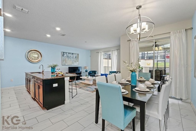 9075 Dogleg Dr, Davenport, FL 33896 - dining space featuring visible vents, marble finish floor, a chandelier, and a textured ceiling
