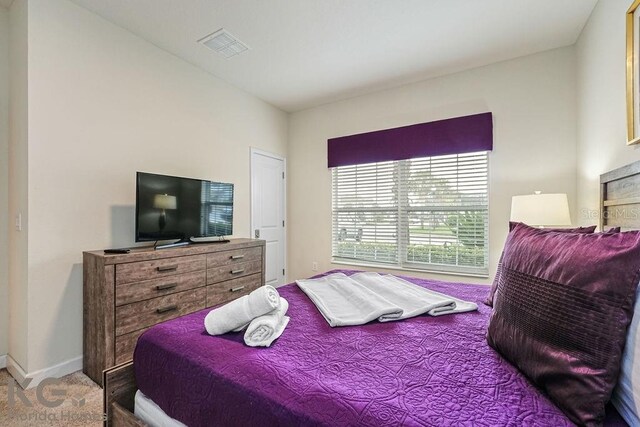 9075 Dogleg Dr, Davenport, FL 33896 - carpeted bedroom with visible vents and baseboards