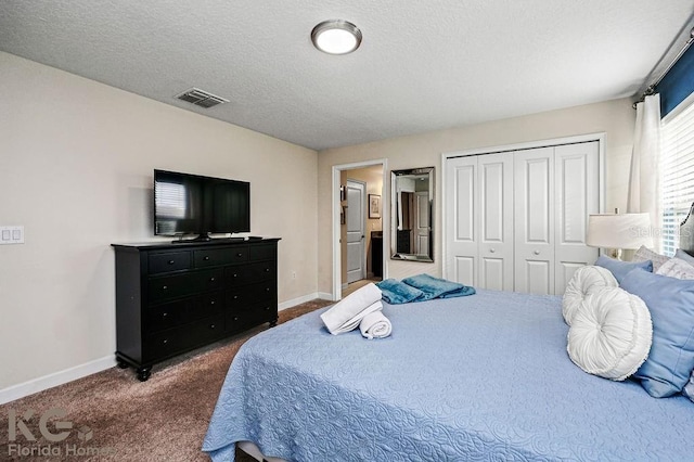 9075 Dogleg Dr, Davenport, FL 33896 - bedroom with a closet, baseboards, carpet flooring, and a textured ceiling