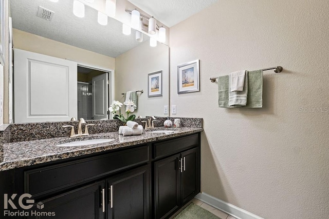 9075 Dogleg Dr, Davenport, FL 33896 - full bathroom featuring tile patterned flooring, double vanity, visible vents, and a sink