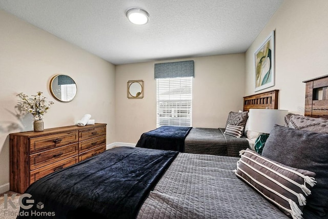 9075 Dogleg Dr, Davenport, FL 33896 - bedroom with baseboards and a textured ceiling