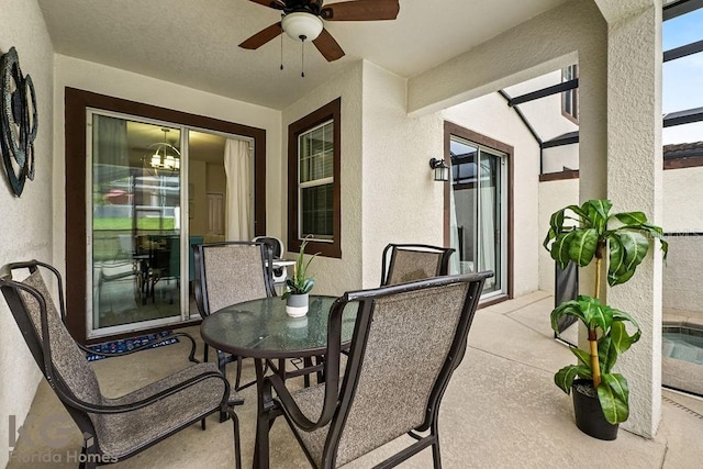 9075 Dogleg Dr, Davenport, FL 33896 - view of patio featuring a lanai, outdoor dining space, and ceiling fan