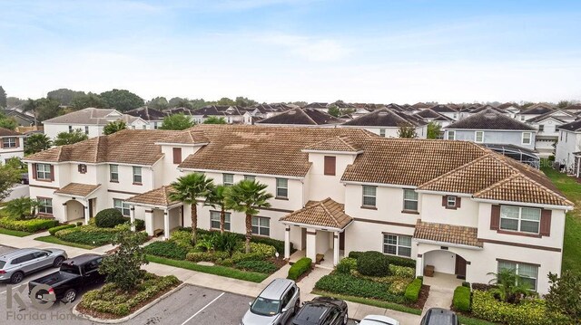9075 Dogleg Dr, Davenport, FL 33896 - view of front of property featuring a residential view, stucco siding, uncovered parking, and a tile roof