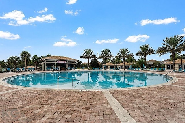 9075 Dogleg Dr, Davenport, FL 33896 - community pool featuring a gazebo and a patio