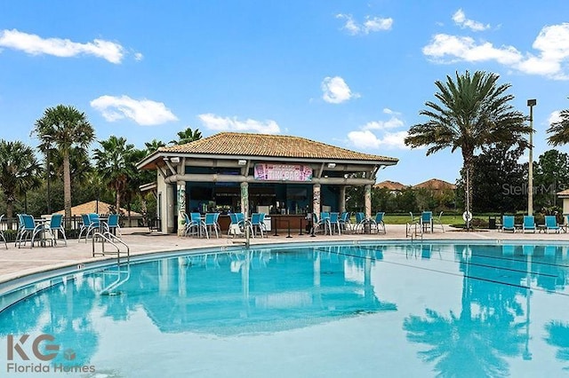 9075 Dogleg Dr, Davenport, FL 33896 - pool featuring a patio and fence
