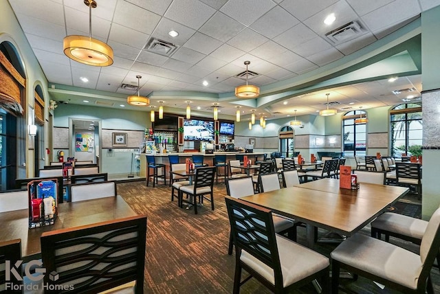 9075 Dogleg Dr, Davenport, FL 33896 - dining area with visible vents and a drop ceiling